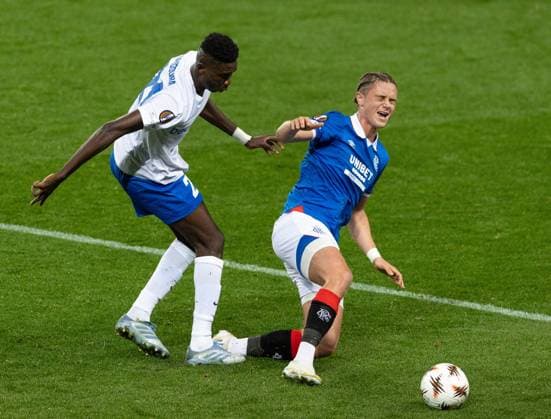 Thelo Aasgaard of Rangers in action with Ibrahima Sory Bangoura of KRC Genk during UEFA Europa League league phase match at Ibrox Stadium, Glasgow. Rangers v KRC Genk - UEFA Europa League - Ibrox Stadium, Glasgow, Lanarkshire, Scotland, UK - 25 Sep 2025Glasgow Ibrox Stadium Lanarkshire, Scotland United Kingdom EDITORIAL USE ONLY  Copyright: xRangersxFC Shutterstockx 15504638ah