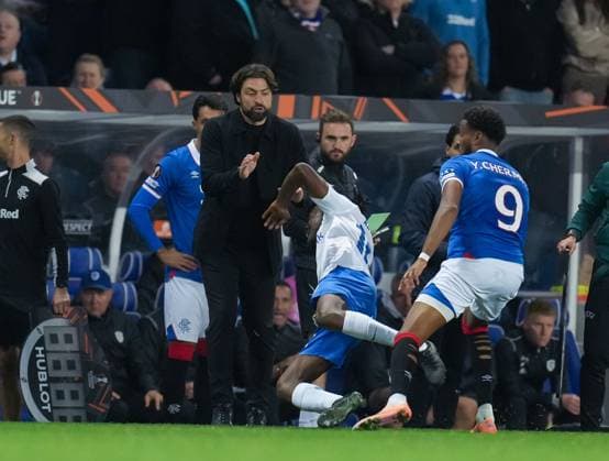 Joris Kayembe of Genk collides with Rangers Manager Russell Martin after a challenge from Youssef Chermiti of Rangers, knocking Rangers Manager Russell Martin to the ground in the technical area. Rangers v Genk, UEFA Europa League, Football, Ibrox Stadium, Glasgow, Scotland, UK - 25 Sep 2025Glasgow Ibrox Stadium Scotland United Kingdom EDITORIAL USE ONLY No use with unauthorised audio, video, data, fixture lists, club league logos or live services. Online in-match use limited to 120 images, no video emulation. No use in betting, games or single club league player publications. Copyright: xStuartxWallace Shutterstockx 15498613ch