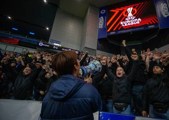 25th September 2025; Ibrox Stadium, Glasgow, Scotland; UEFA Europa League Football, Rangers versus Genk; Oh Hyeon gyu of KRC Genk celebrates with the Genk fans and their megaphone  VagelisxGeorgariou