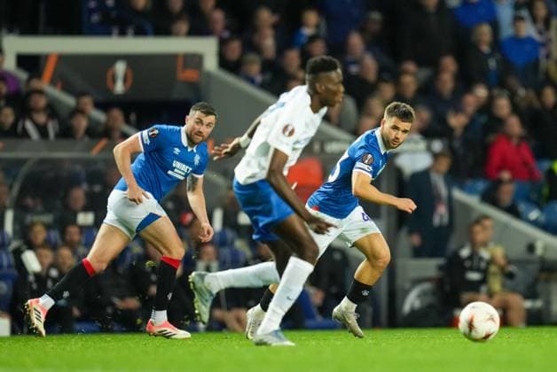 John Souttar of Rangers & Nicolas Raskin of Rangers watch Ibrahima Sory Bangoura of Genk run with the ball. Rangers v Genk, UEFA Europa League, Football, Ibrox Stadium, Glasgow, Scotland, UK - 25 Sep 2025Glasgow Ibrox Stadium Scotland United Kingdom EDITORIAL USE ONLY No use with unauthorised audio, video, data, fixture lists, club league logos or live services. Online in-match use limited to 120 images, no video emulation. No use in betting, games or single club league player publications. Copyright: xStuartxWallace Shutterstockx 15498613dd