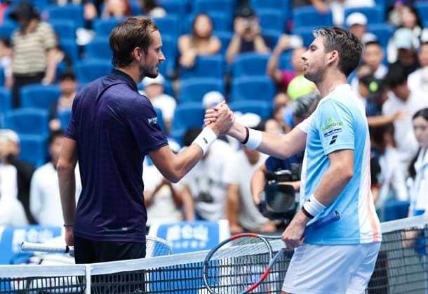 (250926) -- BEIJING, Sept. 26, 2025 -- Daniil Medvedev (L) shakes hands with Cameron Norrie after the men s singles first round match between Daniil Medvedev of Russia and Cameron Norrie of Britain at 2025 China Open tennis tournament in Beijing, China, Sept. 26, 2025. (Photo by Xinhua) (SP)CHINA-BEIJING-TENNIS-CHINA OPEN-MEN S SINGLES-FIRST ROUND (CN) MaxZihan 