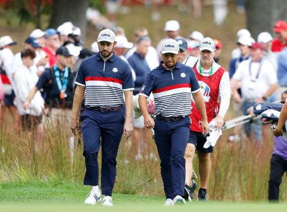 Xander Schauffele and Patrick Cantlay of team United States walk to the 3rd green in their match against Viktor Hovland and Robert MacIntyre of team Europe at the 45th Ryder Cup at The Black Course at Bethpage State Park in Farmingdale, New York on Friday, September 26, 2025. Europe is the current holder of the Ryder Cup after its win over the United States in 2023 at Marco Simone Golf and Country Club.  RYD202509261007 JOHNxANGELILLO
