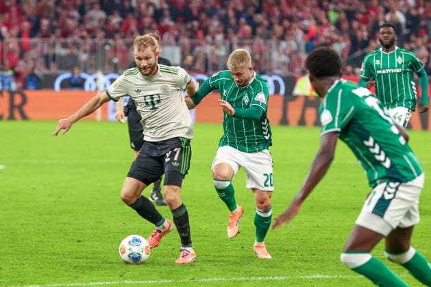 Konrad Laimer 27 FC Bayern Muenchen in action with Romano Schmid 20 SV Werder Bremen , FC Bayern Muenchen vs SV Werder Bremen, DFL, Bundesliga, Saison 2025 2026, Allianz Arena, Hinrunde, 5 Spieltag, 26 09 2025 DFB regulations prohibit any use of photographs as image sequences and or quasi video Muenchen Bayern Germany Copyright: xkolbert-press MartinxAgüerax