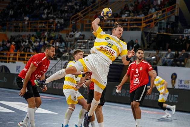 (250927) -- CAIRO, Sept. 27, 2025 -- Lino Messerschmidt (top) of Sydney Uni HC shoots during the 18th IHF Men s Club World Championship, WM, Weltmeisterschaft 2025 preliminary round group C handball match between Al Ahly SC of Egypt and Sydney Uni HC of Australia in Cairo, Egypt, on Sept. 26, 2025. ) (SP)EGYPT-CAIRO-HANDBALL-IHF-MEN S CLUB WORLD CHAMPIONSHIP-PRELIMINARY ROUND MATCH AhmedxGomaa 