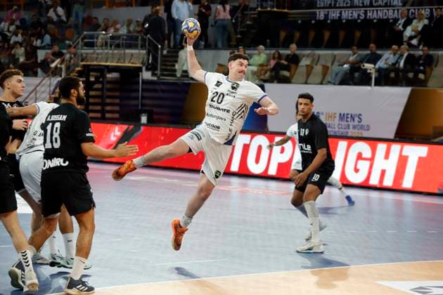 (250927) -- CAIRO, Sept. 27, 2025 -- Pedro Sosa Saitx (top) of Handebol Taubate shoots during the 18th IHF Men s Club World Championship, WM, Weltmeisterschaft 2025 preliminary round group B handball match between Zamalek Club of Egypt and Handebol Taubate of Brazil in Cairo, Egypt, on Sept. 26, 2025. ) (SP)EGYPT-CAIRO-HANDBALL-IHF-MEN S CLUB WORLD CHAMPIONSHIP-PRELIMINARY ROUND MATCH AhmedxGomaa 