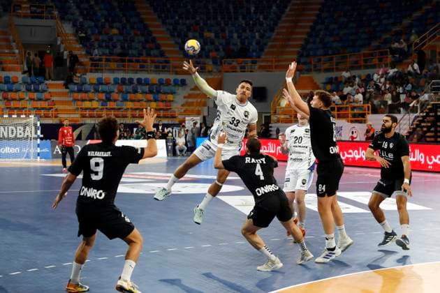 (250927) -- CAIRO, Sept. 27, 2025 -- Gustavo Andade Da Silva (top) of Handebol Taubate competes during the 18th IHF Men s Club World Championship, WM, Weltmeisterschaft 2025 preliminary round group B handball match between Zamalek Club of Egypt and Handebol Taubate of Brazil in Cairo, Egypt, on Sept. 26, 2025. ) (SP)EGYPT-CAIRO-HANDBALL-IHF-MEN S CLUB WORLD CHAMPIONSHIP-PRELIMINARY ROUND MATCH AhmedxGomaa 