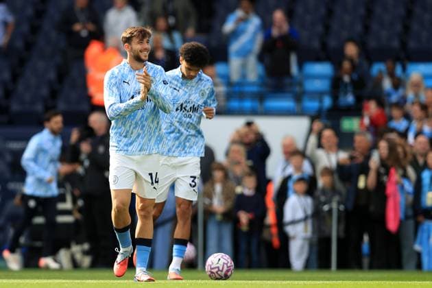 27th September 2025; Etihad Stadium, Manchester, England; Premier League Football, Manchester City versus Burnley; Nico Gonzales of Manchester City smiles as he warms up with his team mates  DavidxBlunsden