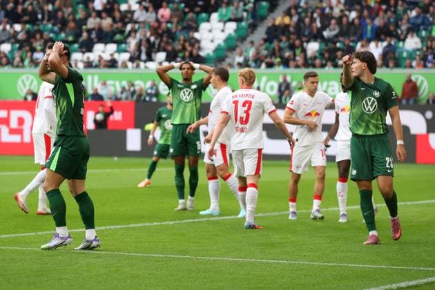 VfL vs Leipzig, 1 BL Wolfsburg, 27 09 2025, FOOTBALL VfL Wolfsburg vs RB Leipzig, 1 BL, Season 2025 26 Konstantinos Koulierakis VfL Wolfsburg , Moritz Jenz VfL Wolfsburg , Jonas Wind VfL Wolfsburg Wolfsburg