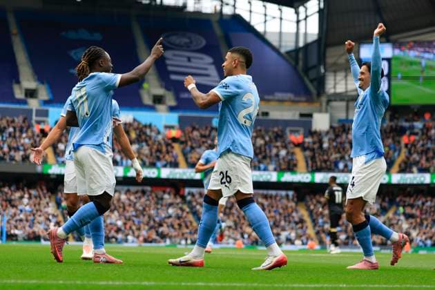 Manchester City v Burnley Premier League 27 09 2025. Jeremy Doku (11) and Savinho (26) of Manchester City celebrate the own goal by Maxime Esteve (5) of Burnley to make it 1-0 during the Premier League match between Manchester City and Burnley at the Etihad Stadium, Manchester, England on 27 September 2025. Manchester Etihad Stadium Manchester England Editorial use only DataCo restrictions apply See www.football-dataco.com , Copyright: xConorxMolloyx PSI-22920-0023