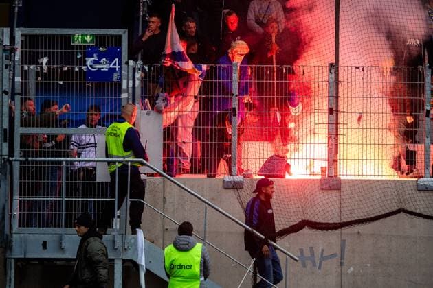 Jena , 270925, Soccer Regionalliga , FC Carl Zeiss Jena vs Chemnitzer FC in the picture Fans Ultras Jena Horda provoke interruption of the game by blocking two escape gates with banners and fans in the block