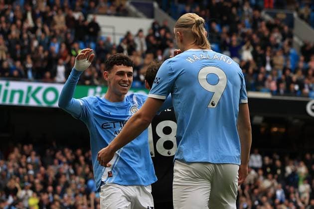 27th September 2025; Etihad Stadium, Manchester, England; Premier League Football, Manchester City versus Burnley; Phil Foden of Manchester City celebrates with team mate Erling Haaland after Esteve put through his own goal scoring for 1-0 after 12 minutes  DavidxBlunsden
