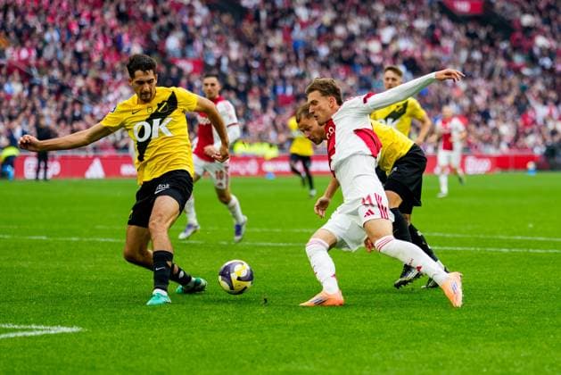 AMSTERDAM, 27-09-2025, Johan Cruijff ArenA , season 2025 2026 , Dutch Eredivisie Football . Match between Ajax and NAC Breda , Picture shows NAC Breda player Leo Greiml , Ajax player Mika Godts and NAC Breda player Boyd Lucassen Ajax - NAC  x31222571x Copyright: