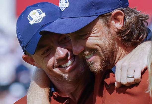 Rory McIlroy (L) and Tommy Fleetwood of Team Europe celebrate on the fifteenth green after defeating Harris English and Collin Morikawa of Team United States in a foursomes match on day two of the 45th Ryder Cup at the Bethpage Black Course in Farmingdale, New York on Saturday, September 27, 2025. Europe has a 8.5 to 3.5 lead over the United States after the morning matches on the second day.  RYD20250927809 JOHNxANGELILLO