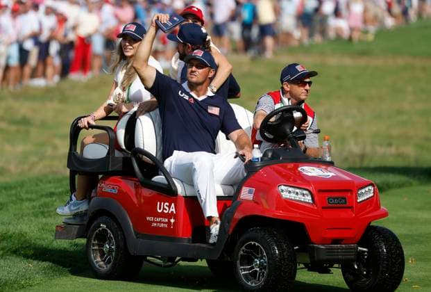 Bryson DeChambeau of Team United States rides a golf cart off the fifteenth green after he and Cameron Young defeated Matt Fitzpatrick and Ludvig Aberg of Team Europe in a foursomes match on day two of the 45th Ryder Cup at the Bethpage Black Course in Farmingdale, New York on Saturday, September 27, 2025. Europe has a 8.5 to 3.5 lead over the United States after the morning matches on the second day.  RYD20250927811 JOHNxANGELILLO