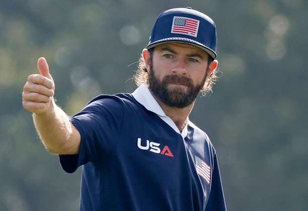 Cameron Young of Team United States waves as he walks off the twelfth green during a foursomes match against Team Europe on day two of the 45th Ryder Cup at the Bethpage Black Course in Farmingdale, New York on Saturday, September 27, 2025. Europe has a 8.5 to 3.5 lead over the United States after the morning matches on the second day.  RYD20250927816 JOHNxANGELILLO
