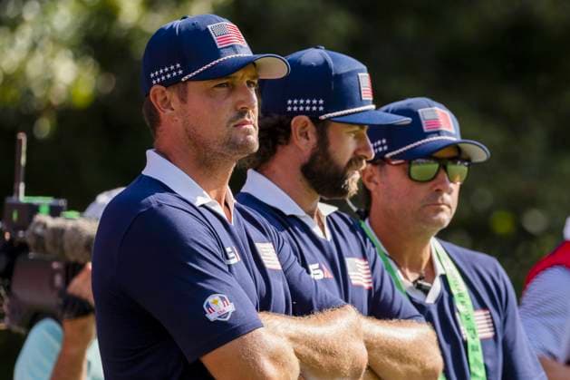 Bryson DeChambeau and Cameron Young of Team United States watch play on the fifteenth green during a foursomes match against Team Europe on day two of the 45th Ryder Cup at the Bethpage Black Course in Farmingdale, New York on Saturday, September 27, 2025. Europe has a 8.5 to 3.5 lead over the United States after the morning matches on the second day.  RYD20250927909 COREYxSIPKIN