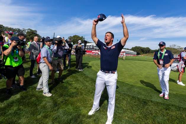 Bryson DeChambeau of Team United States rallies the crowd on the fifteenth hole during a foursomes match against Team Europe on day two of the 45th Ryder Cup at the Bethpage Black Course in Farmingdale, New York on Saturday, September 27, 2025. Europe has a 8.5 to 3.5 lead over the United States after the morning matches on the second day.  RYD20250927999 COREYxSIPKIN