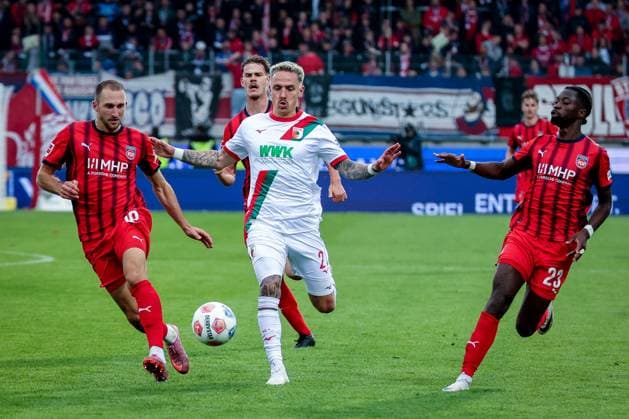 left to right Jonas Foehrenbach 19 1FC Heidenheim 1846 , Phillip Tietz 21 FC Augsburg and Omar Traore 23 1FC Heidenheim 1846 in action, 1 FC Heidenheim 1846 vs FC Augsburg, DFL, Bundesliga, Saison 2025 2026, Voith Arena, Hinrunde, 5 Spieltag, 27 09 2025 DFB regulations prohibit any use of photographs as image sequences and or quasi video Heidenheim Baden Wuerttemberg Germany Copyright: xkolbert-press MartinxAgüerax