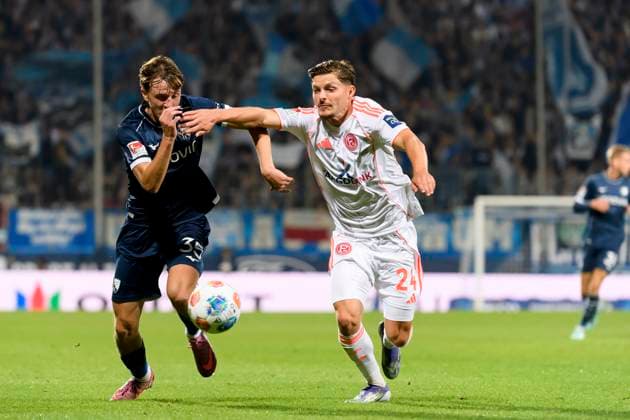 Kacper Koscierski (VfL Bochum) und Florent Muslija (Fortuna Duesseldorf) im Kampf um den Ball waehrend des spiels der 2. Bundesliga zwischen VfL Bochum und Fortuna Duesseldorf, Vonovia Ruhrstadion am 27. September 2025 in Bochum, Deutschland. (Foto von Max Maiwald DeFodi Images) +++ Kacper Koscierski (VfL Bochum) und Florent Muslija (Fortuna Duesseldorf) battle for the ball during the 2. Bundesliga match between VfL Bochum and Fortuna Duesseldorf at Vonovia Ruhrstadion on September 27, 2025 in Bochum, Germany. (Photo by Max Maiwald DeFodi Images) DFB DFL REGULATIONS PROHIBIT ANY USE OF PHOTOGRAPHS AS IMAGE SEQUENCES AND OR QUASI-VIDEO. (Photo by Max Maiwald DeFodi Images) Kacper Koscierski VfL Bochum and Florent Muslija Fortuna Duesseldorf battle for the ball during the 2 Bundesliga match between VfL Bochum and Fortuna Duesseldorf, Vonovia Ruhrstadion on September 27, 2025 in Bochum, Germany, Germany Photo by Max Maiwald DeFodi Images Kacper Koscierski VfL Bochum and Florent Muslija Fortuna Duesseldorf battle for the ball during the 2 Bundesliga match between VfL Bochum and Fortuna Duesseldorf at Vonovia Ruhrstadion on September 27, 2025 in Bochum, Germany Photo by Max Maiwald DeFodi Images DFB DFL REGULATIONS PROHIBIT ANY USE OF PHOTOGRAPHS AS IMAGE SEQUENCES AND OR QUASI VIDEO Photo by Max Maiwald DeFodi Images