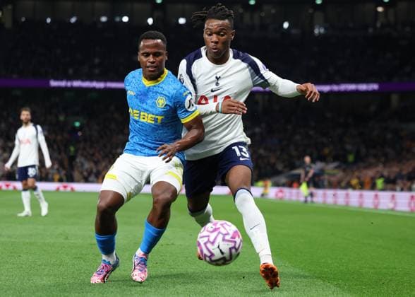 London, England, 27th September 2025. Jhon Arias of Wolverhampton Wanderers and Destiny Udogie of Tottenham Hotspur challenge for the ball during the Tottenham Hotspur vs Wolverhampton Wanderers Premier League match at the Tottenham Hotspur Stadium, London. Picture credit should read: Paul Terry Sportimage EDITORIAL USE ONLY. No use with unauthorised audio, video, data, fixture lists, club league logos or live services. Online in-match use limited to 120 images, no video emulation. No use in betting, games or single club league player publications. SPI_074_PT_Tottenham_Wolves SPI-4168-0074