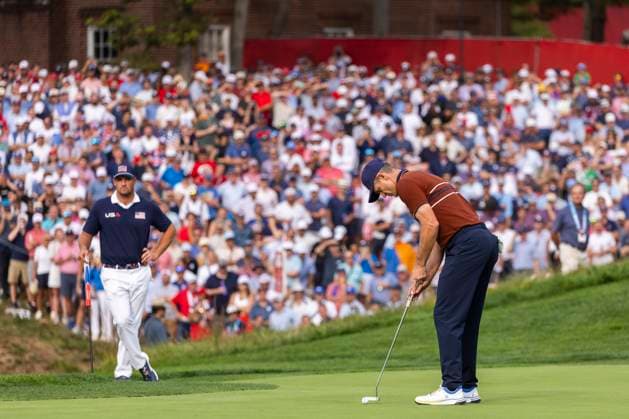 Justin Rose of Team Europe putts on the fourteenth green during a four-ball match against Team United States on day two of the 45th Ryder Cup at the Bethpage Black Course in Farmingdale, New York on Saturday, September 27, 2025. Europe has a 11.5 to 4.5 lead over the United States after the second day.  RYD20250927650 COREYxSIPKIN