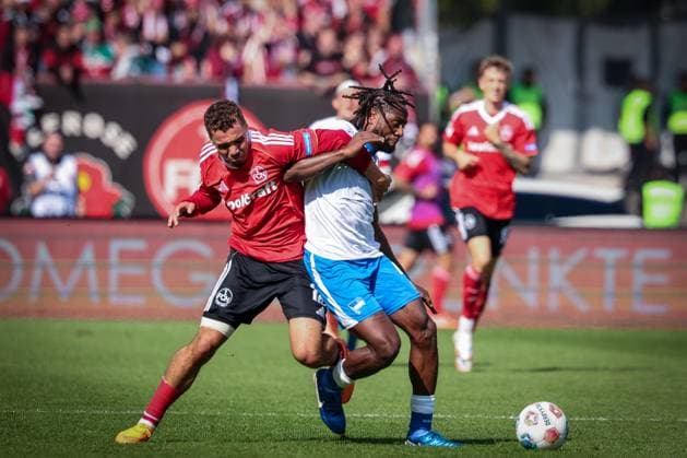 Rafael Lubach 18 1FC Nuernberg , left, in duel with Deyovaisio Zeefuik 42 Hertha BSC Berlin , 1 FC Nuernberg vs Hertha BSC Berlin, DFL, 2 Bundesliga, Saison 2025 2026, Max Morlock Stadion, Hinrunde, 7 Spieltag, 28 09 2025 DFB regulations prohibit any use of photographs as image sequences and or quasi video Nuernberg Bayern Germany Copyright: xkolbert-press MartinxAgüerax