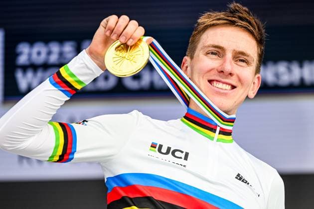 Slovenian Tadej Pogacar celebrates on the podium after winning the elite men road race (267,5 km) at the cycling road World Championships in Kigali, Rwanda, Sunday 28 September 2025. The 2025 UCI Road World Championships take place from 21 to 28 September in Kigali, Rwanda. DIRKxWAEM  x135529791x