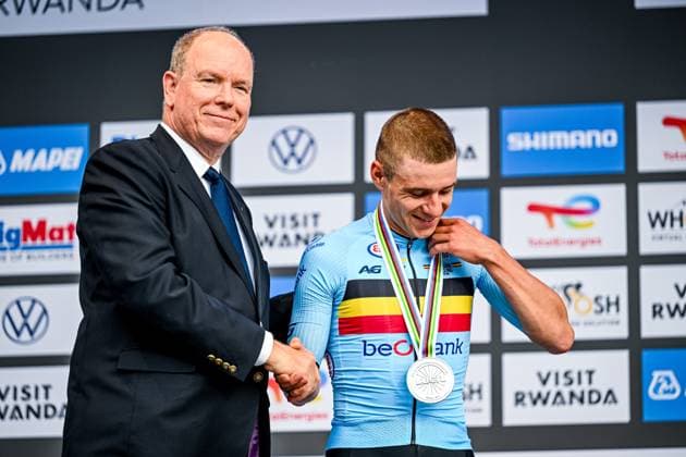 Albert II, Prince of Monaco and Belgian Remco Evenepoel pictured on the podium after the elite men road race (267,5 km) at the cycling road World Championships in Kigali, Rwanda, Sunday 28 September 2025. The 2025 UCI Road World Championships take place from 21 to 28 September in Kigali, Rwanda. DIRKxWAEM  x135531001x