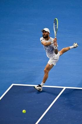 (250928) -- BEIJING, Sept. 28, 2025 -- Corentin Moutet returns a shot during the men s singles second round match between Corentin Moutet of France and Alexander Zverev of Germany at 2025 China Open tennis tournament in Beijing, China, Sept. 28, 2025. ) (SP)CHINA-BEIJING-TENNIS-CHINA OPEN-MEN S SINGLES-SECOND ROUND (CN) XinxMengchen 