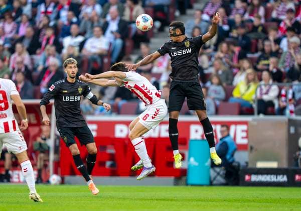 Header duel between Luca Jaquez VfB Stuttgart, 14 and Eric Martel 1 FC Koeln, 6 28 09 2025, 1 FC Köln VfB Stuttgart Fussball, 1 Bundesliga, RheinEnergieStadion Köln DFL regulations prohibit any use of photographs as image sequences and or quasi video Copyright: HMBxMedia xMarcoxBader