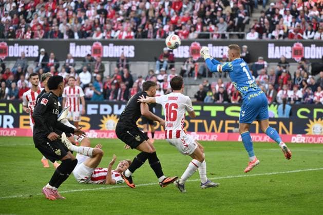 Goalkeeper Marvin Schwäbe 1 FC Koeln saves with a fist save 28 09 2025, Soccer 1 Bundesliga, Season 2025 2026, 5 Matchday, 1 FC Köln VfB Stuttgart DFL regulations prohibit any use of photographs as image sequences and or quasi video Koeln RheinEnergieStadion Nordrhein Westfalen Germany Team2