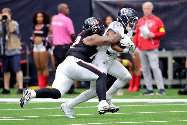September 28, 2025, Houston, Texas, U.S: Tennessee Titans running back Tony Pollard (20) is tackled by Houston Texans defensive tackle Tommy Togiai (72) during the first quarter of the NFL, American Football Herren, USA game between the Houston Texans and the Tennessee Titans at NRG Stadium in Houston, TX on September 28, 2025. Houston U.S - ZUMAw137 20250928_aap_w137_011 Copyright: xErikxWilliamsx