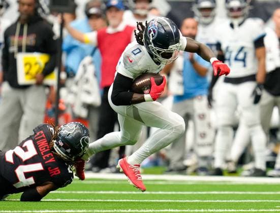 September 28, 2025, Houston, Texas, USA: Tennessee Titans wide receiver CALVIN RIDLEY (0) is tackled by Houston Texans cornerback DEREK STINGLEY JR. (24) after a catch during the first half of an NFL, American Football Herren, USA game between the Houston Texans and the Tennessee Titans on September 28, 2025 in Houston, Texas. Houston USA - ZUMAc201 20250928_zap_c201_007 Copyright: xScottxColemanx