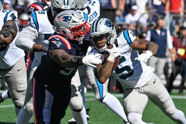 Sep 28, 2025; Foxborough, Massachusetts, USA; New England Patriots defensive end Milton Williams (97) tackles Carolina Panthers running back Rico Dowdle (5) during the first half at Gillette Stadium, in Foxborough, Massachusetts. CSM Foxborough USA - ZUMAc04_ 20250928_zma_c04_040 Copyright: xEricxCanhax