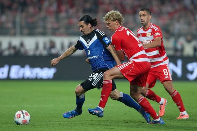 28.09.2025, xtgx, Fussball - 1.Bundesliga Union Berlin - Hamburger SV v.l. Rayan Philippe (HSV, 14), Leopold Querfeld (Union Berlin, 14) Zweikampf, Duell, Kampf, tackle (DFL DFB REGULATIONS PROHIBIT ANY USE OF PHOTOGRAPHS as IMAGE SEQUENCES and or QUASI-VIDEO) Berlin
