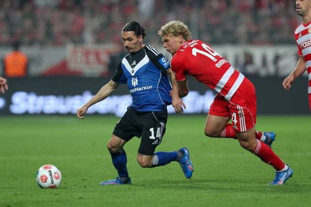28.09.2025, xtgx, Fussball - 1.Bundesliga Union Berlin - Hamburger SV v.l. Rayan Philippe (HSV, 14), Leopold Querfeld (Union Berlin, 14) Zweikampf, Duell, Kampf, tackle (DFL DFB REGULATIONS PROHIBIT ANY USE OF PHOTOGRAPHS as IMAGE SEQUENCES and or QUASI-VIDEO) Berlin