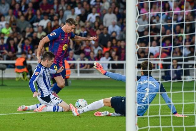 FC Barcelona, Barca v REAL SOCIEDAD OLIMPIC STADIUM LLUIS COMPANYS. MONTJUIC,BARCELONA. September 28, 2025 FC BARCELONA vs REAL SOCIEDAD September 28, ,2025 Robert Lewandowski (9) of FC Barcelona dribbles Zubeldia (5) of Real Sociedad and A.Remiro (1) goalkeeper of Real Sociedad during the match between FC Barcelona and Real Sociedad corresponding to the seventh day of La Liga EA Sports at at Olimpic Stadium Lluis Companys of MontjuÃ¯c in Barcelona, Spain. Barcelona ESP Copyright: xS.xRosx