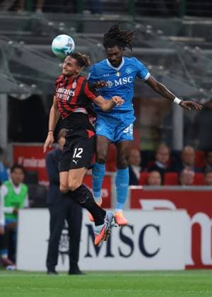 Milan, Italy, 28th September 2025. Frank Andre Anguissa of SSC Napoli heads on from Adrien Rabiot of AC Milan during the AC Milan vs Napoli Serie A match at Giuseppe Meazza, Milan. Picture credit should read: Jonathan Moscrop Sportimage EDITORIAL USE ONLY. No use with unauthorised audio, video, data, fixture lists, club league logos or live services. Online in-match use limited to 120 images, no video emulation. No use in betting, games or single club league player publications. SPI_047_JM_MILAN_NAPOLI SPI-4164-0047