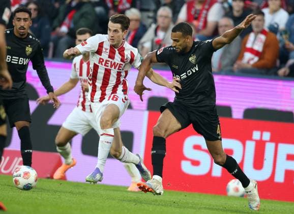 FC Koeln Vs VfB Stuttgar in Koeln, Germany - 28 Sep 2025 Jakub Kaminski of FC Koeln and Josha Vagnoman of Vfb Stuttgart in action during the Bundesliga match between VfB Stuttgart and FC Koeln at RheinEnergie Stadion. ( Final score; VfB Stuttgart 2:1 FC Koeln ) Koeln Germany Copyright: xOsamaxFaisalx xSOPAxImagesx QA012