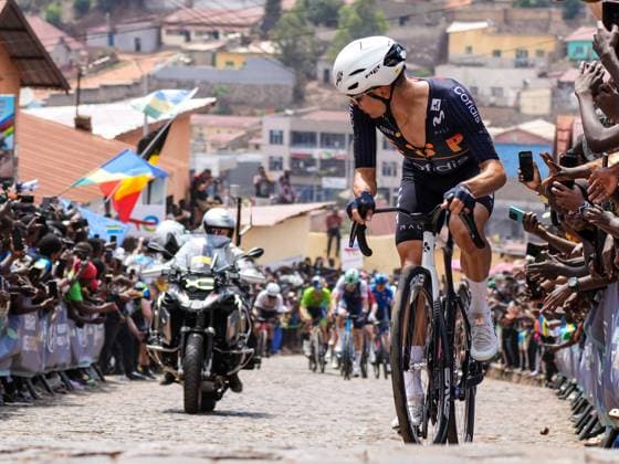 (250929) -- KIGALI, Sept. 29, 2025 -- A cyclist looks back during the men s elite road race at the 2025 UCI Road World Championships in Kigali, Rwanda, on Sept. 28, 2025. ) (SP)RWANDA-KIGALI-CYCLING-UCI-ROAD WORLD CHAMPIONSHIPS-MEN ELITE ROAD RACE LixYahui 