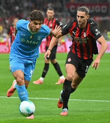 (250929) -- MILAN, Sept. 29, 2025 -- AC Milan s Adrien Rabiot (R) vies with Napoli s Luca Marinucci during a Serie A soccer match between AC Milan and Napoli in Milan, Italy, Sept. 28, 2025. (Photo by Xinhua) (SP)ITALY-MILAN-FOOTBALL-SERIE A-AC MILAN VS NAPOLI AlbertoxLingria 