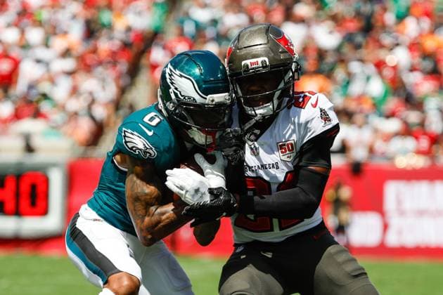 September 28, 2025, Tampa, Florida, USA: Tampa Bay Buccaneers cornerback Benjamin Morrison (21) tackles Philadelphia Eagles wide receiver Devonta Smith (6) during the second quarter at Raymond James Stadium in Tampa on Sunday, Sept. 28, 2025. Tampa USA - ZUMAs70_ 20250928_zan_s70_108 Copyright: xJeffereexWoox