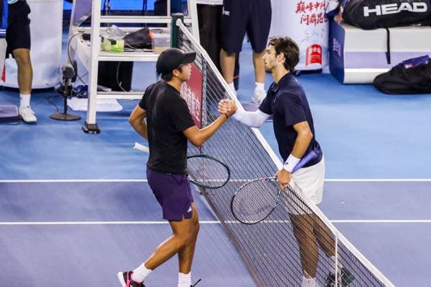 BEIJING, CHINA - SEPTEMBER 29: Learner Tien of the United States shakes hands with Lorenzo Musetti of Italy after the Men s Singles Quarterfinal match on day 8 of the 2025 China Open at the National Tennis Center on September 29, 2025 in Beijing, China.  Copyright: xVCGx 111594026064
