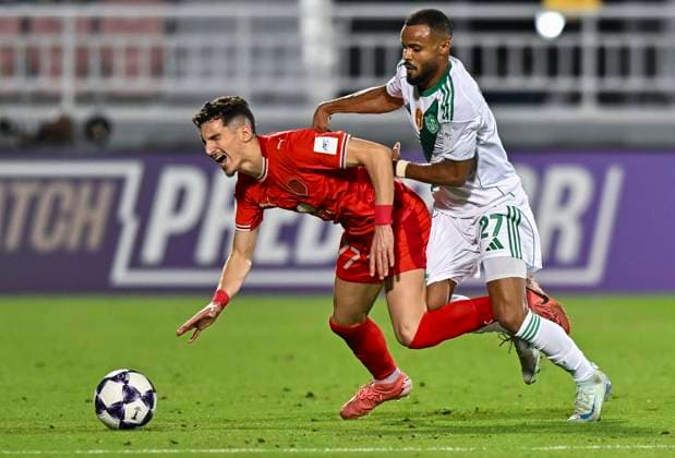 AFC CHAMPIONS LEAGUE ELITE, AL DUHAIL SC (QAT) V AL AHLI SAUDI FC (KSA) Adil Boulbina (L) of Al Duhail SC and Ali Hassan Majrashi of Al Ahli Saudi FC in action during the AFC Champions League elite west football match between Qatar s Al Duhail SC and Saudi Arabia s Al Ahli Saudi FC at Abdullah Bin Khalifa Stadium in Doha, Qatar, on September 29, 2025. DOHA Qatar Copyright: xNAUSHADx