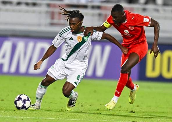 AFC CHAMPIONS LEAGUE ELITE, AL DUHAIL SC (QAT) V AL AHLI SAUDI FC (KSA) Almoez Ali (R) of Al Duhail SC and Valentin Atangana of Al Ahli Saudi FC in action during the AFC Champions League elite west football match between Qatar s Al Duhail SC and Saudi Arabia s Al Ahli Saudi FC at Abdullah Bin Khalifa Stadium in Doha, Qatar, on September 29, 2025. DOHA Qatar Copyright: xNAUSHADx