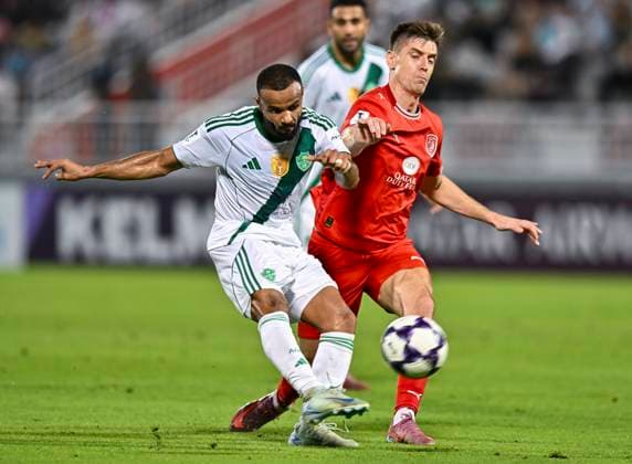AFC CHAMPIONS LEAGUE ELITE, AL DUHAIL SC (QAT) V AL AHLI SAUDI FC (KSA) Krzysztof Piatek (R) of Al Duhail SC and Ali Hassan Majrashi of Al Ahli Saudi FC in action during the AFC Champions League elite west football match between Qatar s Al Duhail SC and Saudi Arabia s Al Ahli Saudi FC at Abdullah Bin Khalifa Stadium in Doha, Qatar, on September 29, 2025. DOHA Qatar Copyright: xNAUSHADx