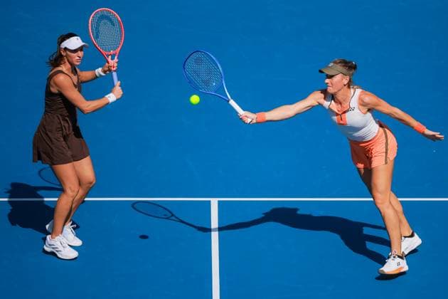 BEIJING, CHINA - SEPTEMBER 30: Timea Babos of Hungary and Luisa Stefani of Brazil return a shot in the Women s Doubles Round of 16 match against Xu Yifan and Yang Zhaoxuan of China on day 9 of the 2025 China Open at the National Tennis Center on September 30, 2025 in Beijing, China.  Copyright: xVCGx 111594165001