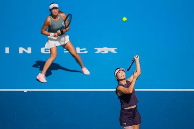 BEIJING, CHINA - SEPTEMBER 30: Xu Yifan and Yang Zhaoxuan of China return a shot in the Women s Doubles Round of 16 match against Timea Babos of Hungary and Luisa Stefani of Brazil on day 9 of the 2025 China Open at the National Tennis Center on September 30, 2025 in Beijing, China.  Copyright: xVCGx 111594164949
