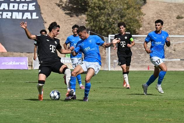 Uefa Youth League Paphos FC U19 FC Bayern München U19 30 09 2025 in duel Adin LICINA FCB 7 and Andreas CHRISTOFOROU Paphos FC U19 70 duel UEFA Youth League Paphos FC U19 FC Bayern München U19 Stelios Kyriakides Stadium on 30 09 2025 Copyright: xBEAUTIFULxSPORTS Goldbergx