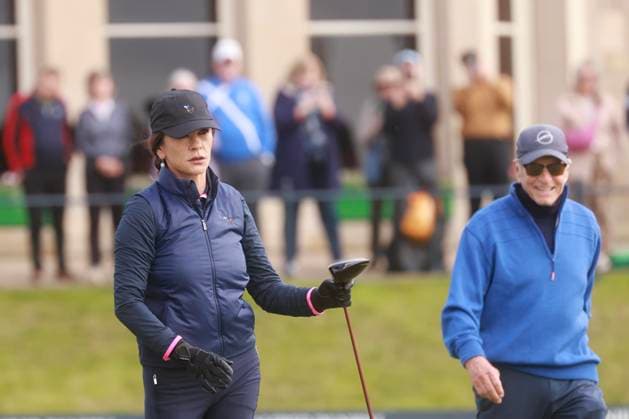 30th September 2025; The Old Course at St Andrews, Fife, Scotland; Alfred Dunhill Links Golf Championship, Practice Round; Actress Catherine Zeta-Jones watches the flight of her shot from the tee on the first hole as her husband Actor Michael Douglas smiles in the background  DavidxYoung